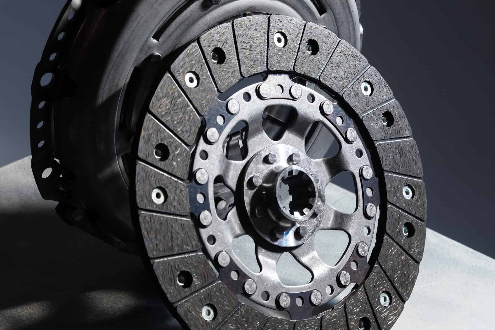 Car clutch disc close-up for a guide explaining how long does a clutch last and what affects clutch lifespan.